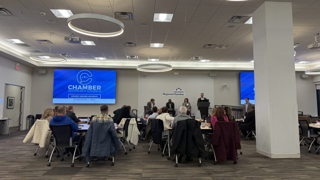 several groups of people in a large room listing to the 2025 post-election recap